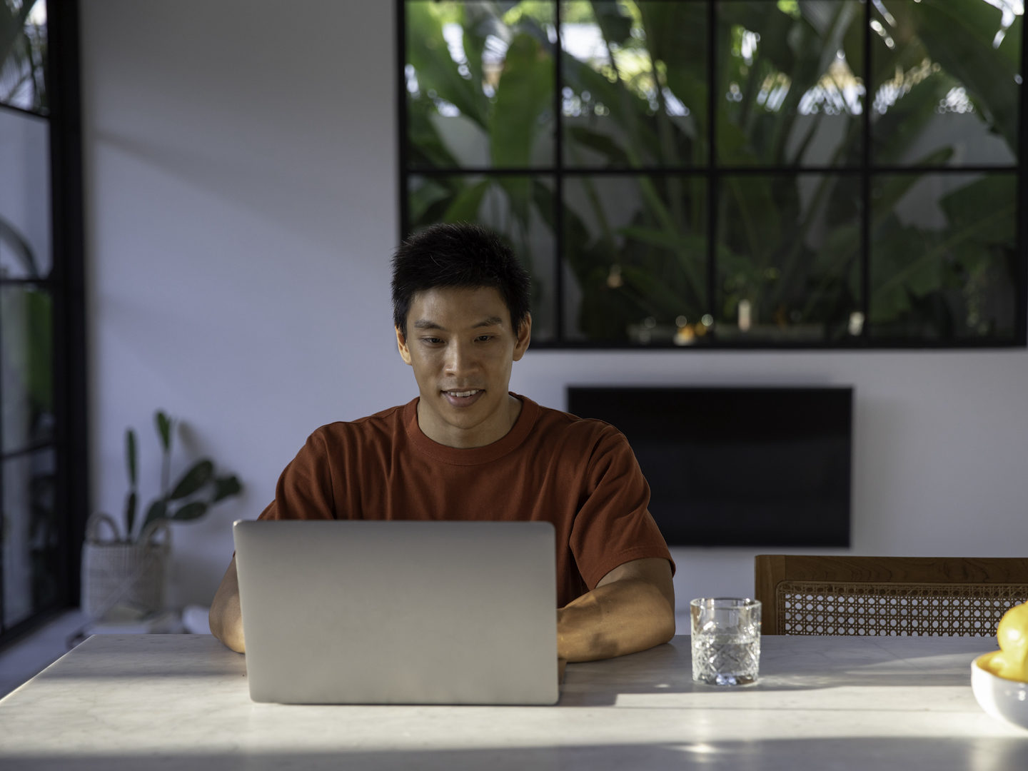 Asian man working from home lemons