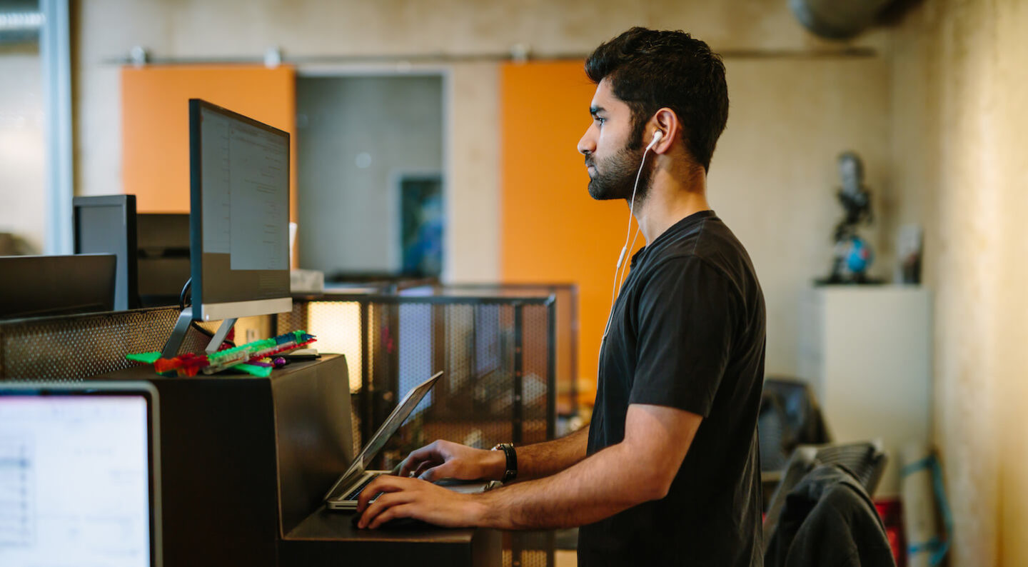 Man working at standing desk