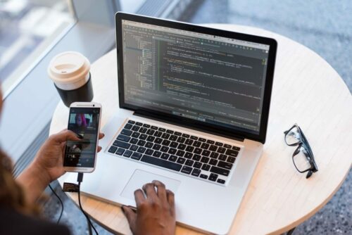 Laptop with code connected to smartphone
